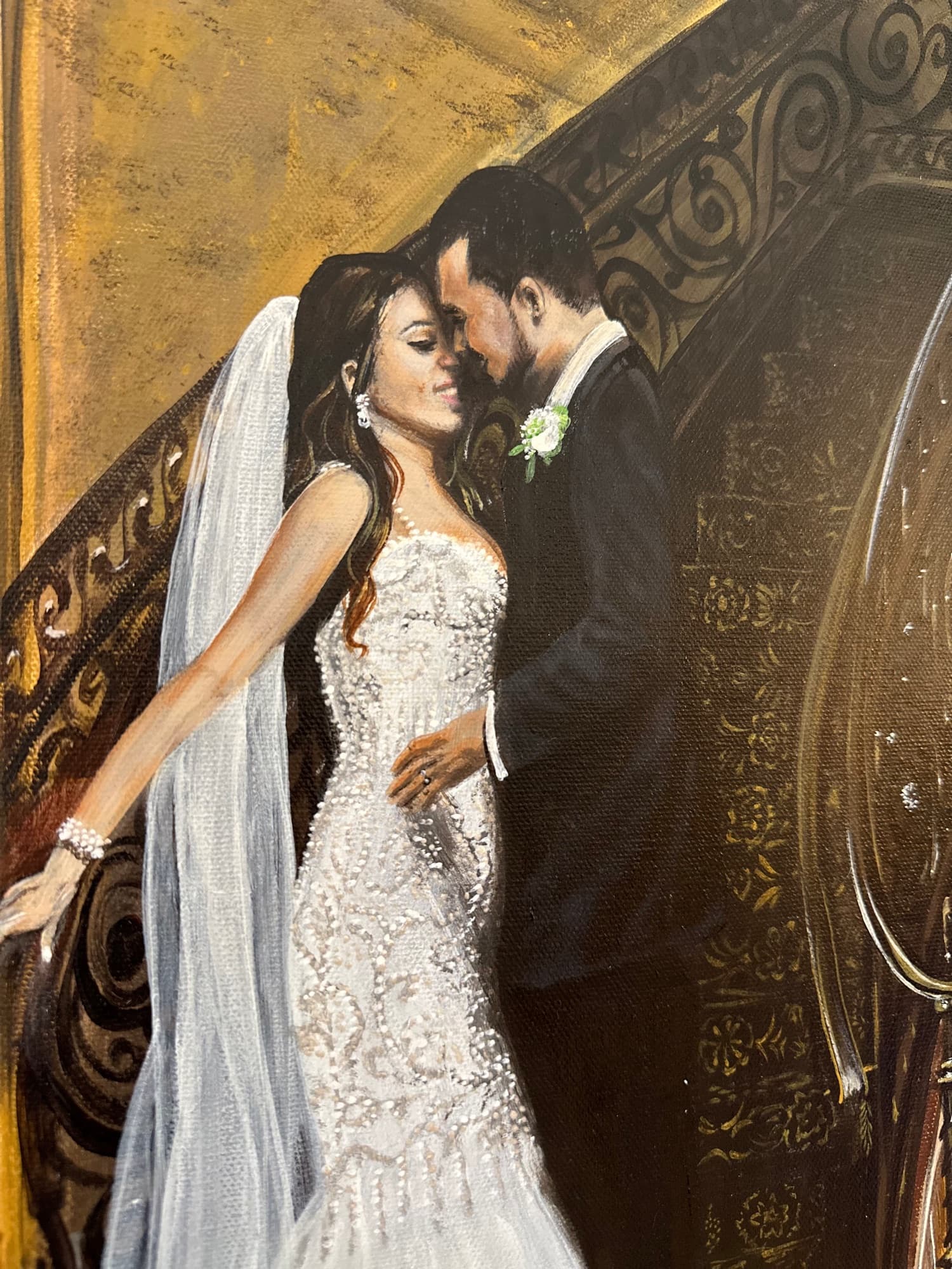 Close detail of the bride and groom — beaded gown, veil, and boutonniere