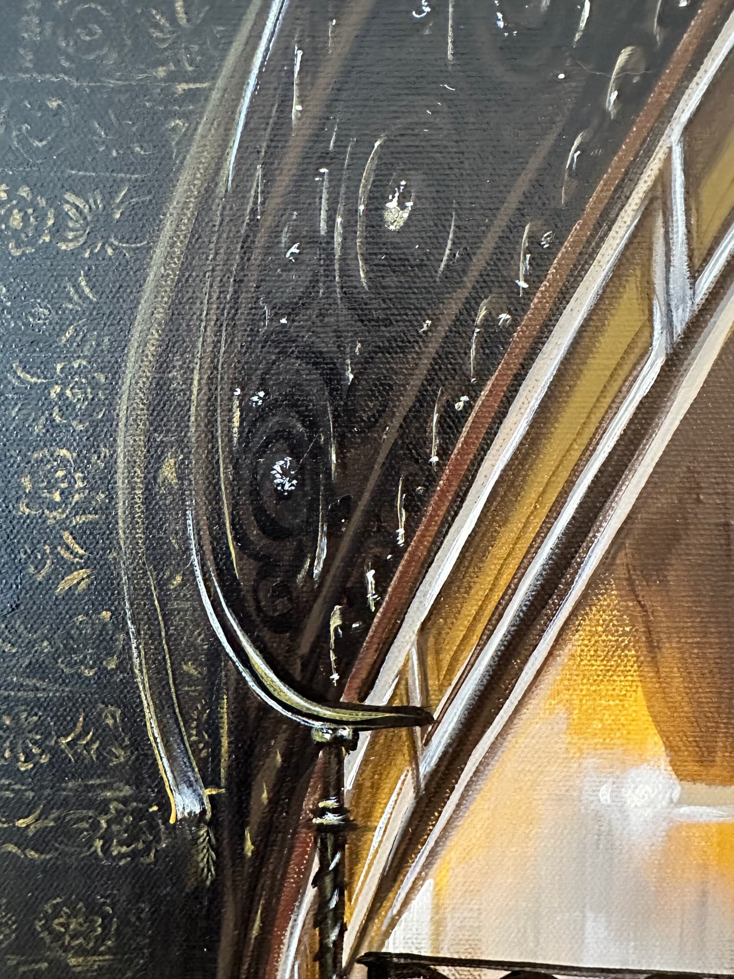 Closeup of the wrought-iron banister and warm wall texture