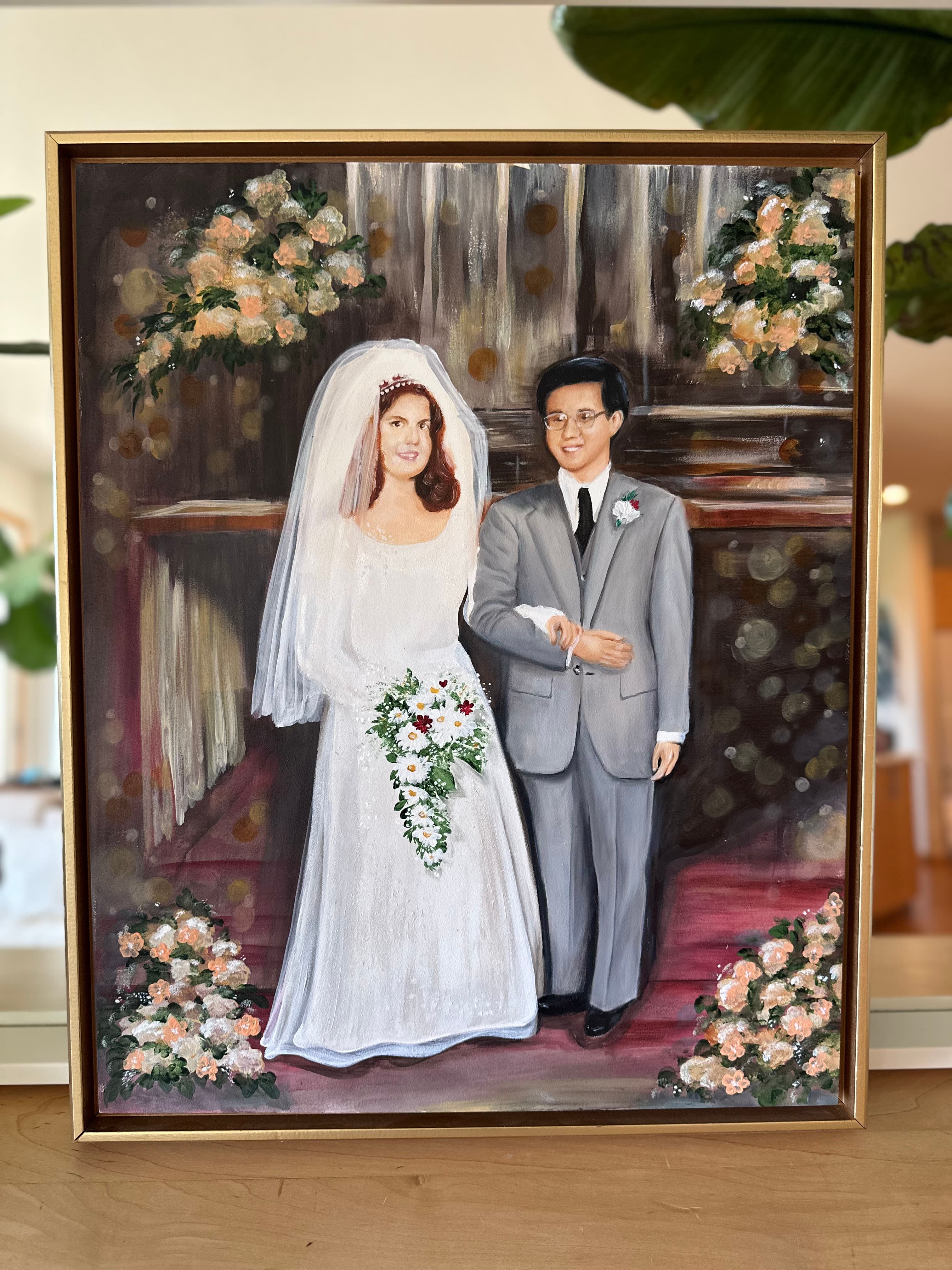 Straight-on view of the 50th anniversary wedding painting with roses framing the aisle