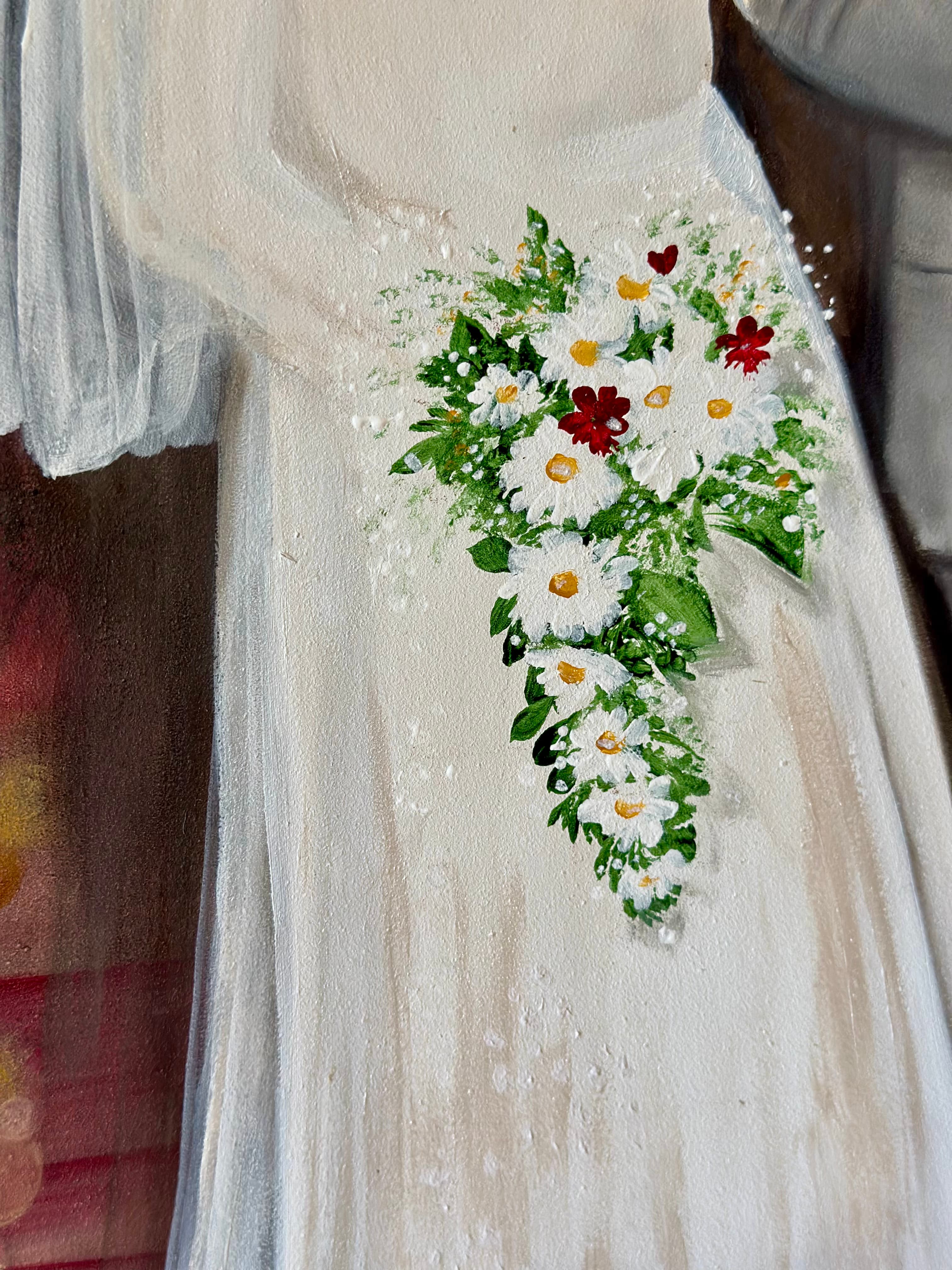 Closeup of the cascading daisy bouquet against the bride's gown