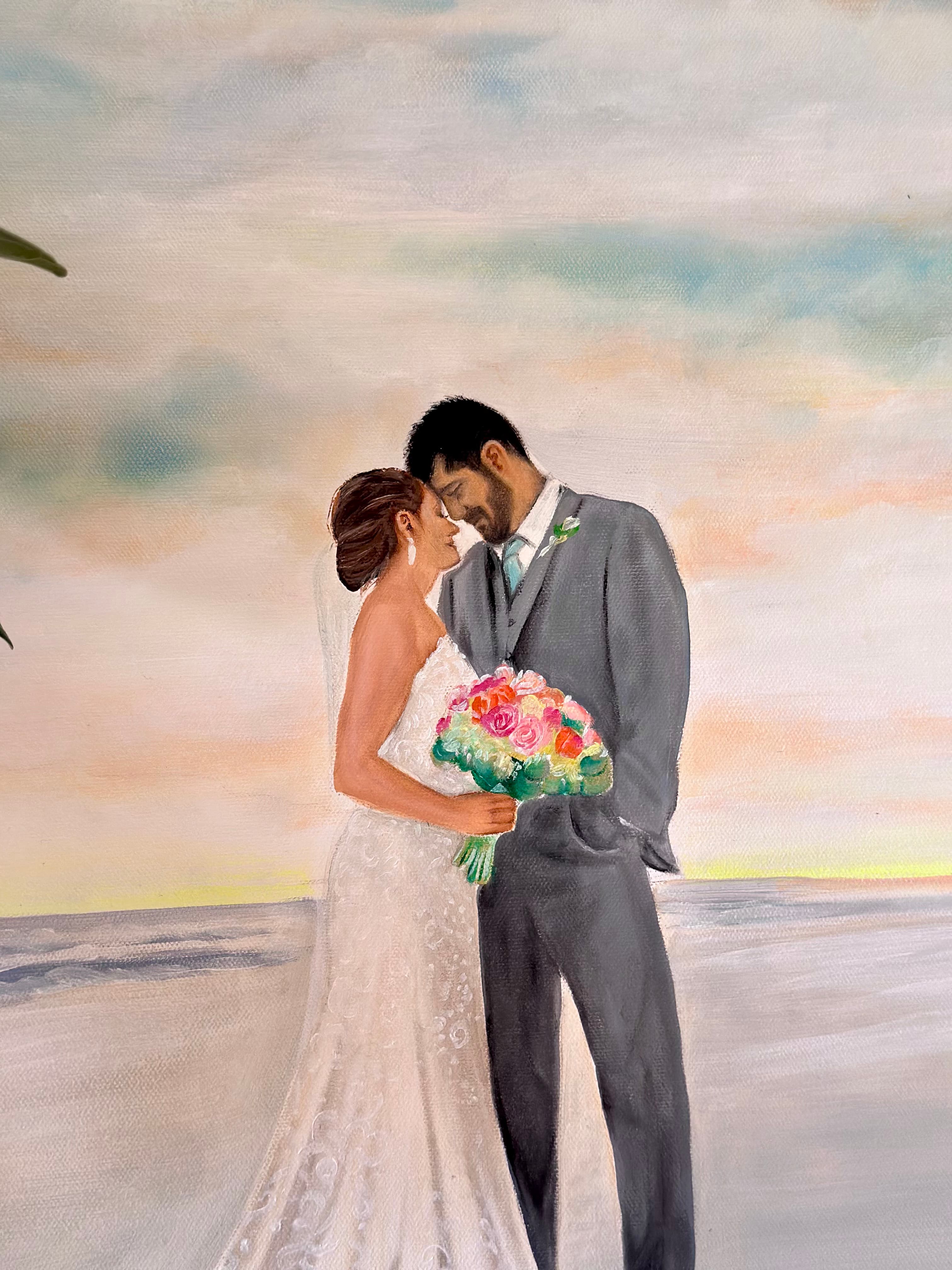 Close detail of the couple forehead to forehead — her lace dress, his gray suit, and the colorful bouquet against the sunset