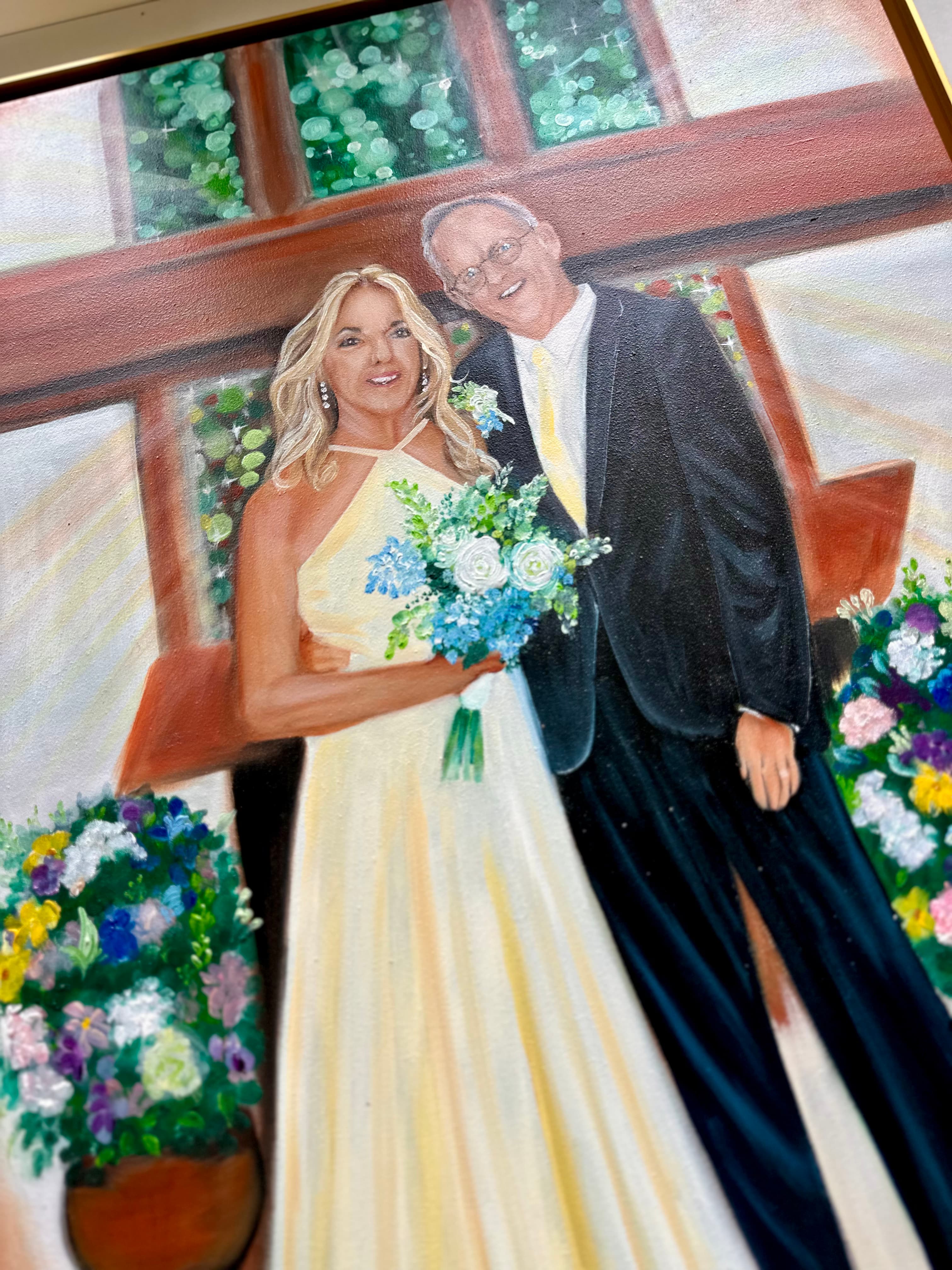 Closer look at the couple — her yellow-toned dress, the blue and white bouquet, and his boutonniere